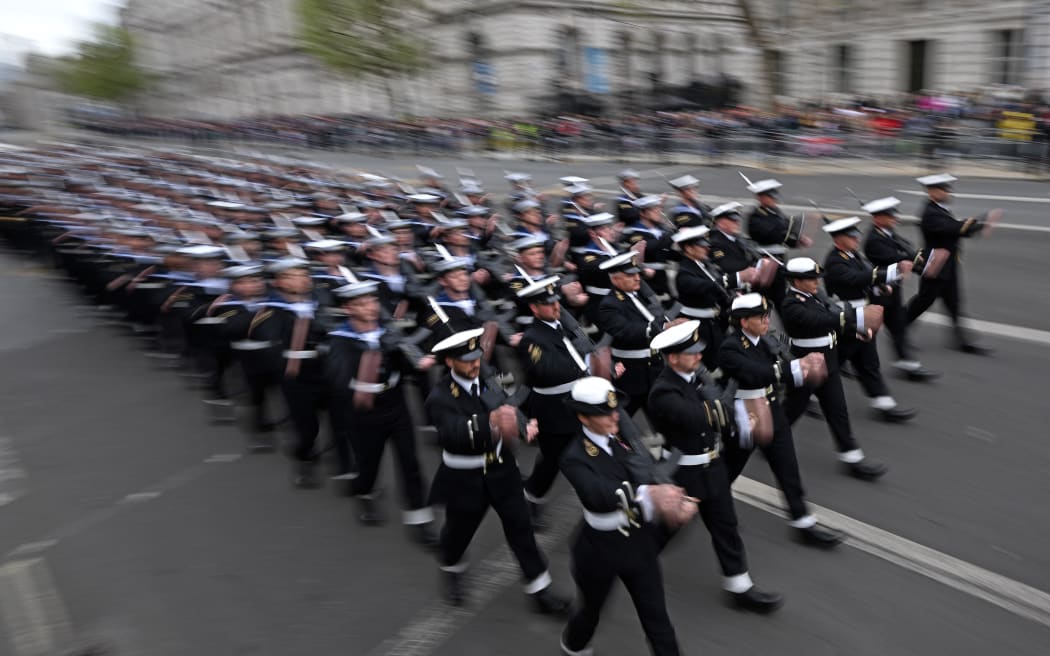 Memebers of Britain's Armed Forces march along the route of the 'King's Procession', a two kilometres stretch from Buckingham Palace to Westminster Abbey, in central London, on May 6, 2023 ahead of the Coronation of King Charles III. - The set-piece coronation is the first in Britain in 70 years, and only the second in history to be televised. Charles will be the 40th reigning monarch to be crowned at the central London church since King William I in 1066. Outside the UK, he is also king of 14 other Commonwealth countries, including Australia, Canada and New Zealand. Camilla, his second wife, will be crowned queen alongside him and be known as Queen Camilla after the ceremony. (Photo by LOIC VENANCE / AFP)