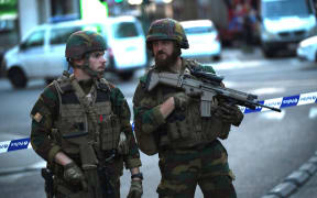 Soldiers stand at a cordoned off area on a street outside Gare Centrale in Brussels.