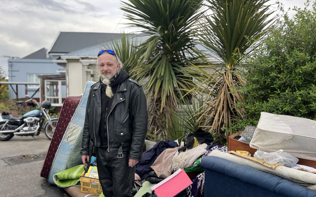 Peter van Welie with soaked belongings headed for the dump on 7 October, 2024, after flooding in Dunedin.