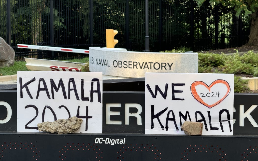 Signs outside a US Naval Observatory where US Vice president Kamala Harris lives, in Washington, DC on 21 July, 2024, after Biden announced he would step aside from the 2024 presidential race.