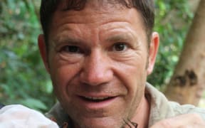 Steve Backshall with a tarantula hawk wasp and a tarantula.