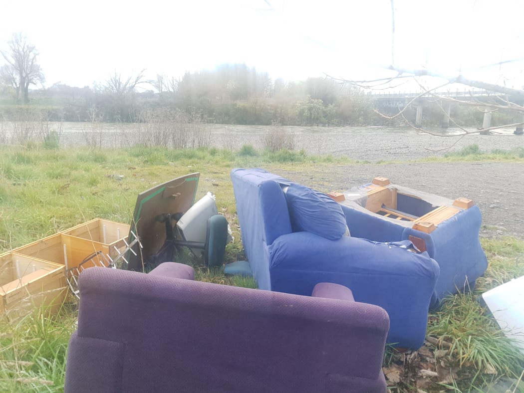 Dumped furniture, near the Waiohine River, near State Highway 2, between Greytown and Carterton. Two Wairarapa district councils, Greater Wellington Regional Council, and NZTA all said clearing the furniture was not their problem, before Carterton council workers cleared up the mess.