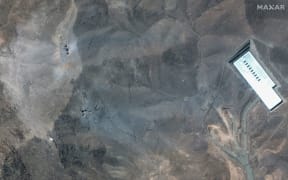 This satellite image provided by Maxar Technologies shows a closer view of craters and ash on a ridge at Fordow enrichment facility in Iran after US strikes, Sunday, June 22.
Mandatory Credit:	Maxar Technologies/AP via CNN Newsource