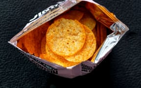 An open packet of crisps.