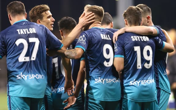 David Ball (C) of Wellington celebrates with teammates after scoring a goal during the A-League match against Macarthur FC at Campbelltown Stadium, in Campbelltown, Friday, June 4, 2021.