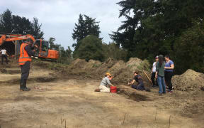 Researchers at Lawrence cemetery