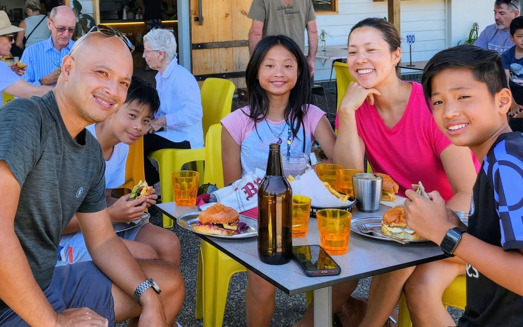 Tegan Chen (middle) with her parents and two brothers.