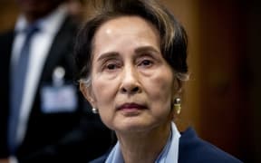 (FILES) In this file photo taken on December 11, 2019, then Myanmar's State Counsellor Aung San Suu Kyi looks on before the UN's International Court of Justice in the Peace Palace of The Hague, on the second day of her hearing on the Rohingya genocide case. - A Myanmar junta court sentenced ousted leader Aung San Suu Kyi to three years in jail for electoral fraud, a source with knowledge of the case said September 2, 2022. Suu Kyi was "sentenced to three years imprisonment with hard labour", the source said, adding that the Nobel laureate, 77, appeared to be in good health.