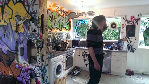 Conor Dunlevey surveys the mess at his friend's house in Christchurch.