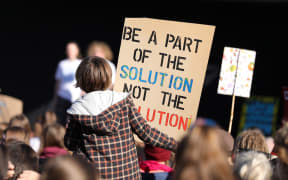 Students gather at Hagley Park in Christchurch to protest climate change.