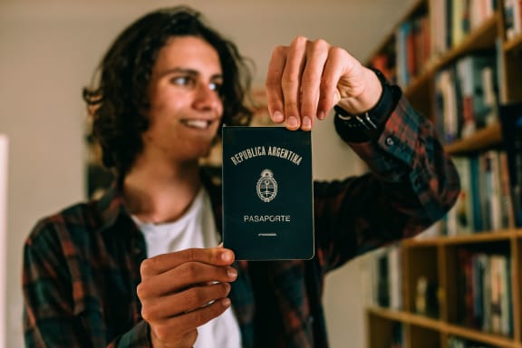 Felix Blaha showing his Father's Argentinian passport.