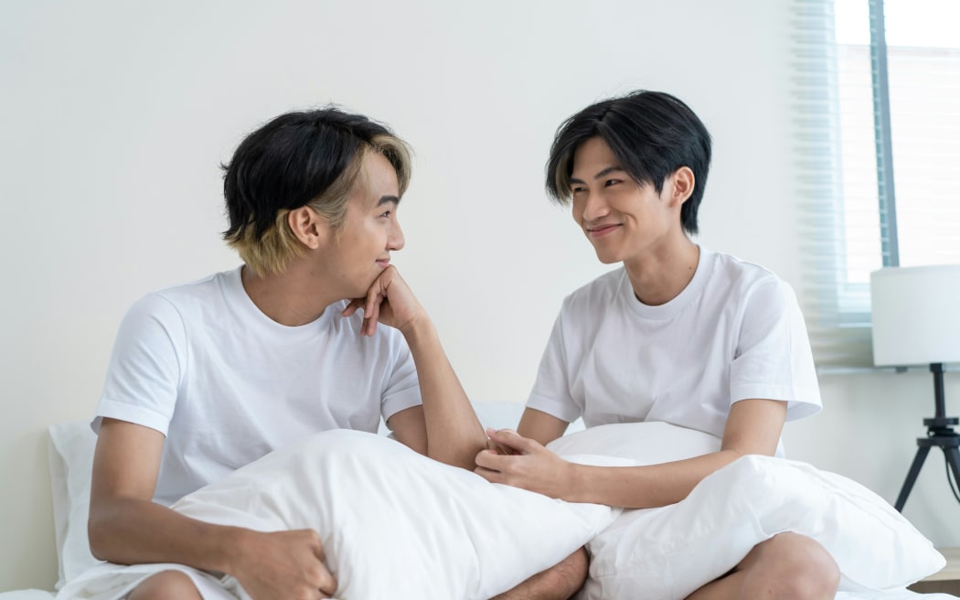 Two young Asian men