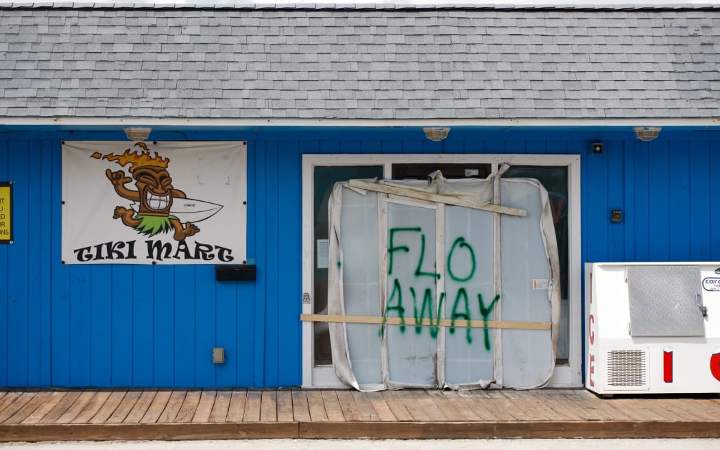 A Tiki bar sits empty with a message for Hurricane Florence on Topsail Island, North Carolina.