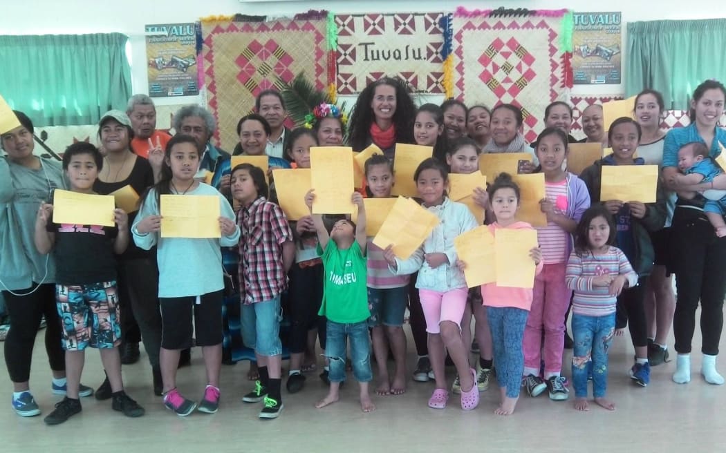 Tuvaluan poet Selina Tusitala Marsh, back centre, shares her talents and skills with the Tuvaluan community. Photo/PMN/File