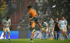 Wallabies loose forward Rob Valetini, top, and centre Hamish Stewart celebrate victory after beating Argentina in a Rugby Championship Test match at the UNO Jorge Luis Hirschi Stadium in La Plata, Buenos Aires Province. , on August 31, 2024.