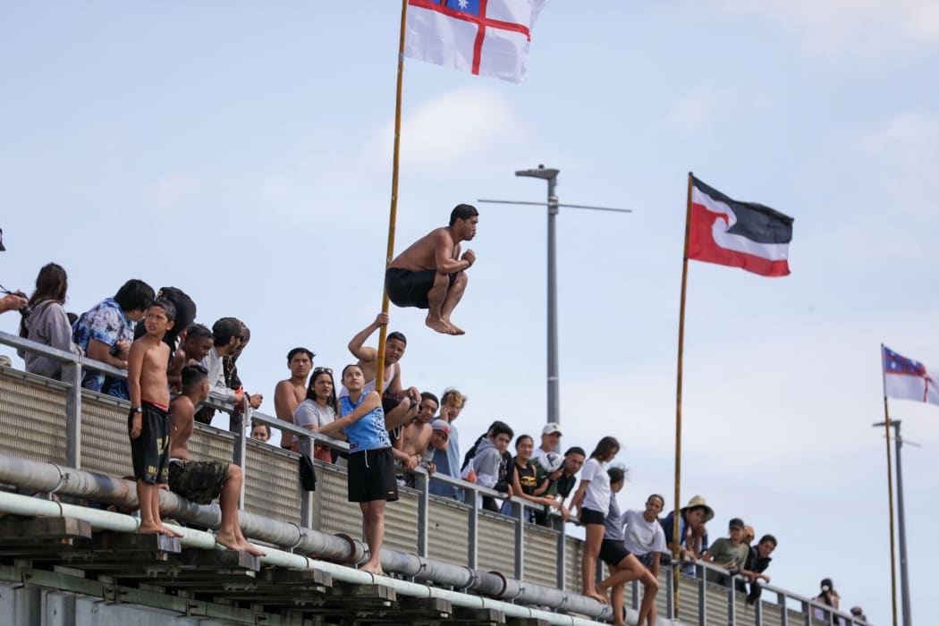 Popping a manu off Waitangi's one-lane bridge.