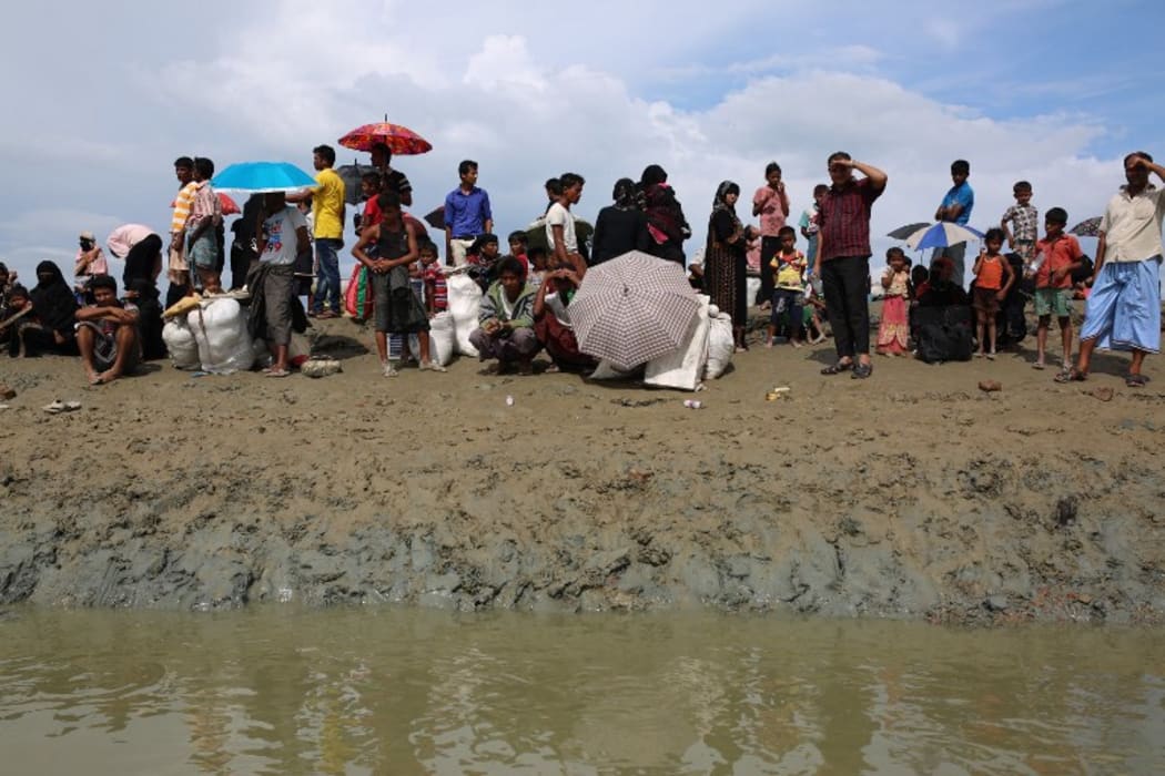 Rohingya Muslims who fled from ongoing military operations in Myanmar’s Rakhine state wait for a boat to a makeshift camp on hills at Cox's Bazar, Bangladesh.