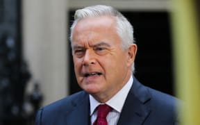 File photo. Huw Edwards speaks in front of a camera in Downing Street in central London on 5 September 2022 during coverage of the Conservative party leadership election.