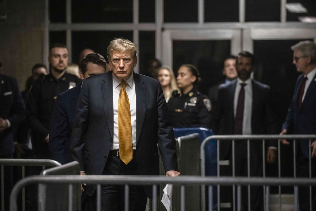 Former US President and Republican presidential candidate Donald Trump arrives to speak to the press at the end of the day's proceedings in his criminal trial at Manhattan Criminal Court in New York City, on May 21, 2024. Donald Trump's defense lawyers rested their case Tuesday -- without the former president following through on a vow to testify -- as the judge planned jury deliberations in the historic criminal trial for early next week. (Photo by Dave Sanders / POOL / AFP)