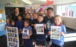 Mangere Bridge School students with the comic.