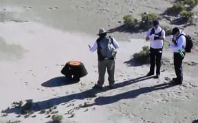 This shot off a NASA live feed of the Osiris-Rex asteroid sample's return craft sitting in the Utah desert at Dugway, Utah, on 24 September, 2023.