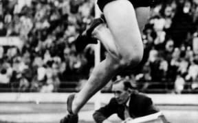 Yvette Williams jumps her way to an Olympic Gold medal with a jump of 6.24m. Helsinki Olympic Games, 1952.