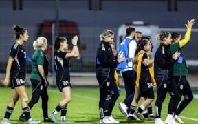 Afghanistan's players greet fans after the FIFA Unites Women's Series match between Afghan Women United and Chad at the Municipal Stadium in Berrechid on October 26, 2025. (Photo by Abdel Majid BZIOUAT / AFP)