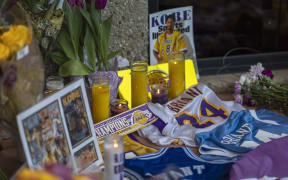 People mourn at a makeshift memorial at Mamba Sports Academy for former NBA great Kobe Bryant, who was killed in a helicopter crash while commuting to the academy on January 26, 2020 in Newbury Park, California.