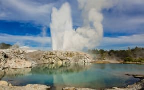 Pohutu Geyser and the blue pool.