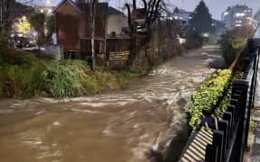 The level of the Water of Leith rising high due to heavy rainfall on 26 July 2022.