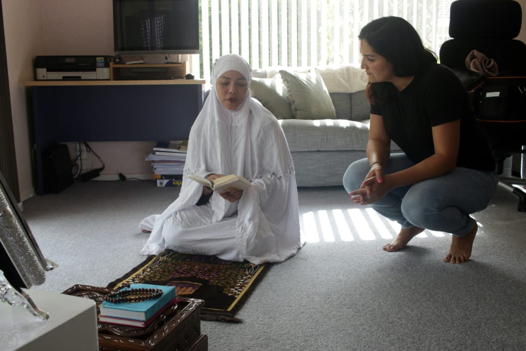 Dewi Astutipuji and Director Ghazaleh Golbakhsh talking about a frame about to be filmed at Dewi's home in Hamilton.