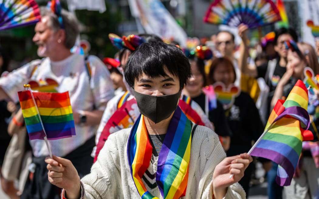 A participant attends the Tokyo Rainbow Pride 2023 Parade in Tokyo on April 23, 2023, to show support for members of the LGBT community. (Photo by Yuichi YAMAZAKI / AFP) / IMAGE RESTRICTED TO EDITORIAL USE