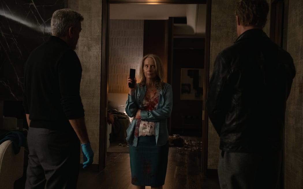 George Clooney, Amy Ryan and Brad Pitt in 'Wolfs'.
