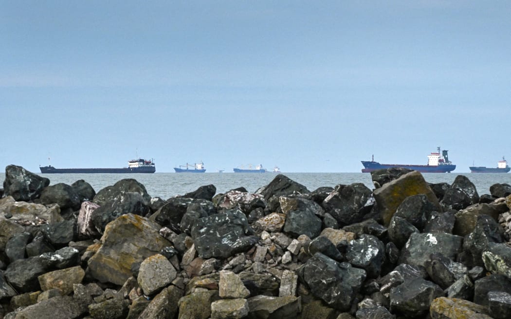Ships anchored in the Black Sea await to enter the Sulina canal in Romania, one of the places the Danube River joins the Black Sea, on 8 June, 2022.