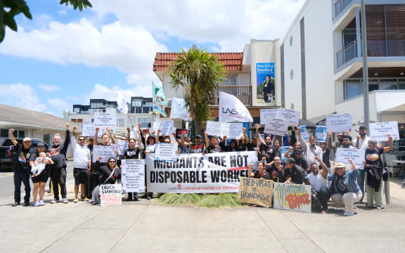 Dozens of protesters gathered outside Immigration Minister Erica Stanford’s Browns Bay office on Thursday.