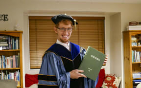 Wesley Webb with his graduation regalia.