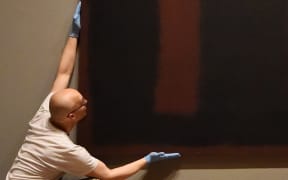 Mark Rothko's 'Black on Maroon'  has gone back on display at the Tate Modern in London.
