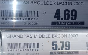 Two supermarket price tags that don't quite add up.