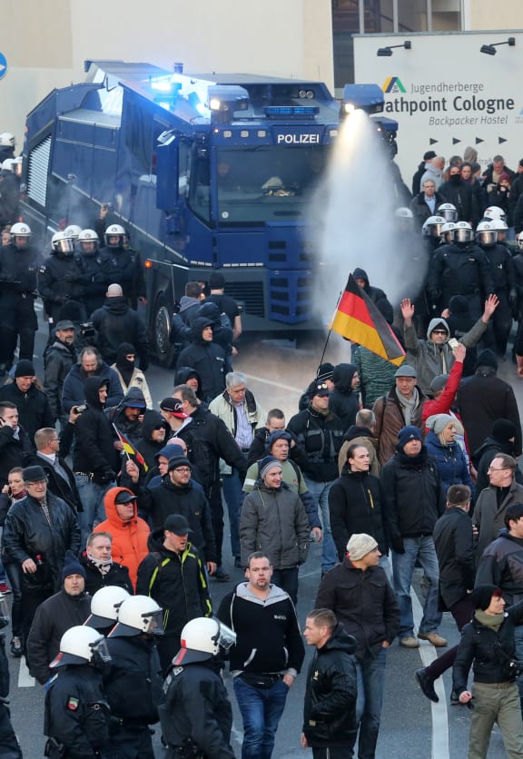 Police using water cannon at a rally of the far-right anti-immigrant Pegida movement in Cologne.
