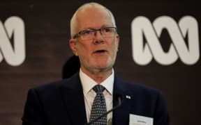 Justin Milne speaking at a ABC event.