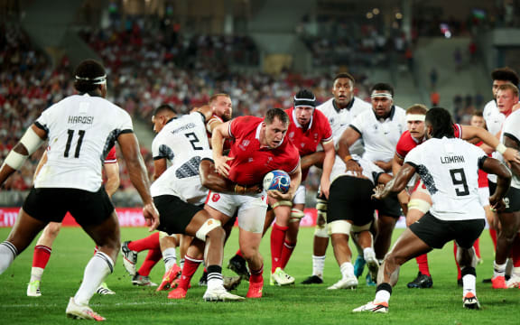 BORDEAUX, FRANCE - SEPTEMBER 10: Ryan Elias of Wales is tackled whilst running with the ball during the Rugby World Cup France 2023 match between Wales and Fiji at Nouveau Stade de Bordeaux on September 10, 2023 in Bordeaux, France. (Photo by Adam Pretty - World Rugby/World Rugby via Getty Images)