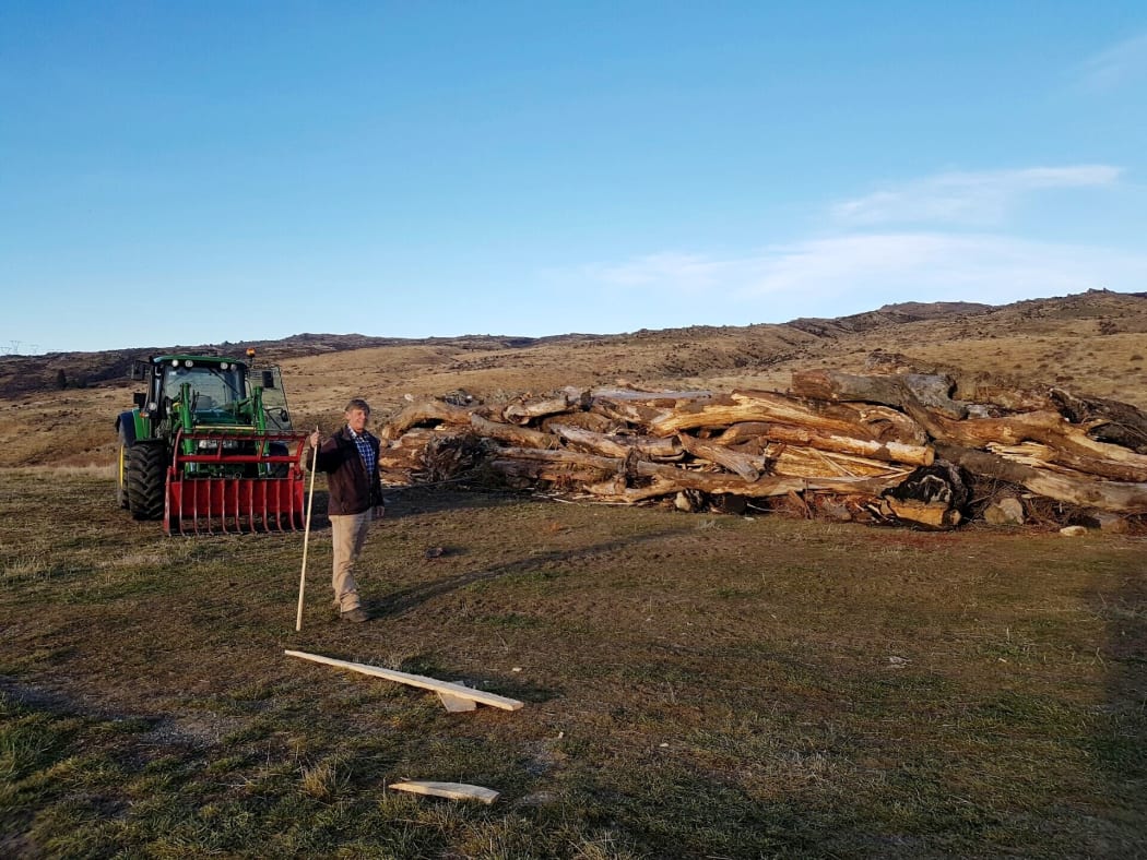 Ken Gillespie prepares the bonfire for the Brass Monkey Rally in Central Otago