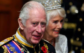 Britain's King Charles III and Britain's Queen Camilla leave from the Norman Porch after the State Opening of Parliament, at the Houses of Parliament, in London, on November 7, 2023. (Photo by TOBY MELVILLE / POOL / AFP)