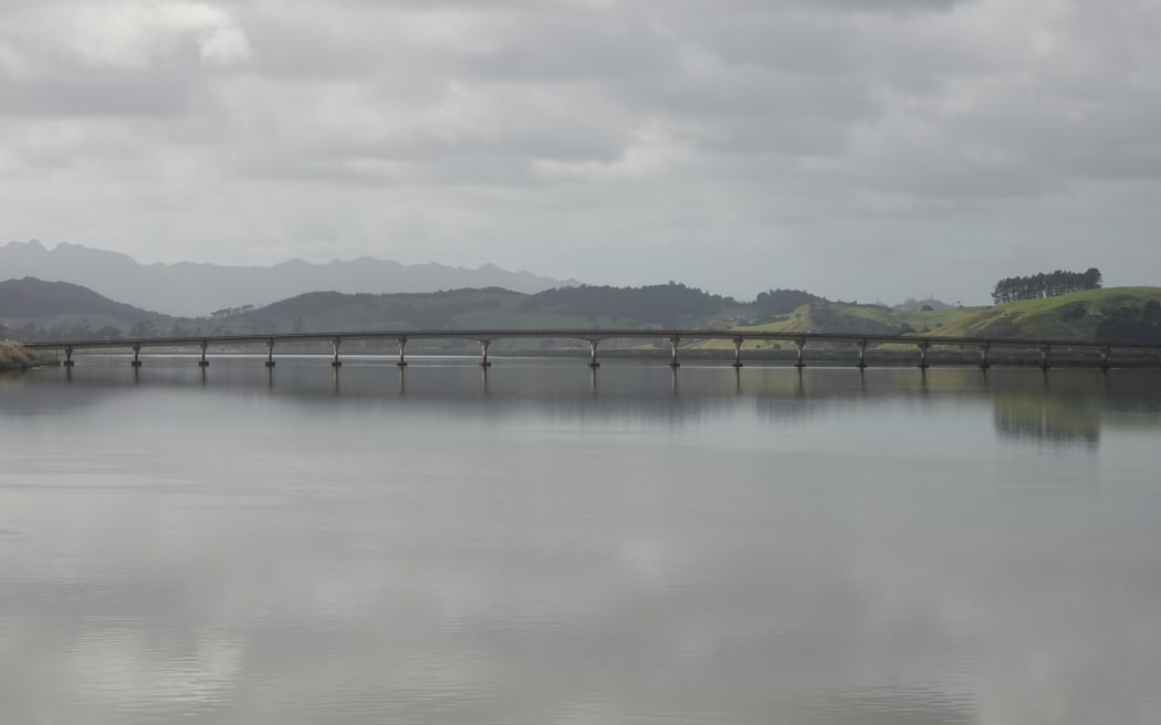 The broad Northern Wairoa flows under the State Highway 14 bridge on the outskirts of Dargaville.