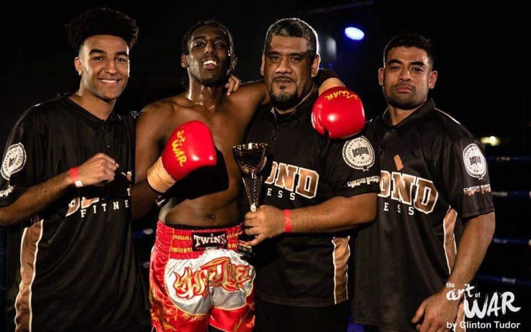 Hayellom Tesfay (L) and Zak Kezo (R) after a kickboxing bout involving Kezo.