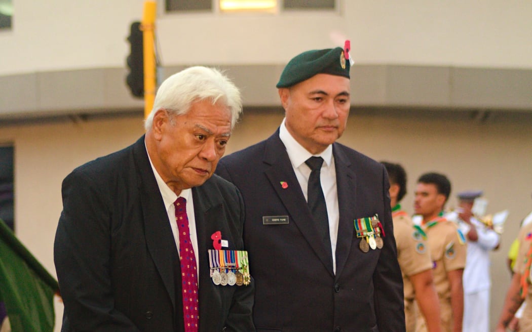 Samoa Deputy Prime Minister Tuala Tevaga Ponfasio (right) stands alongside veteran at Apia Town Clock Tower, April 25, 2023