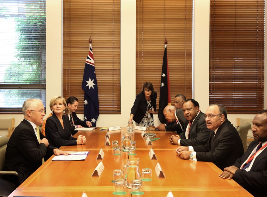 Australian Prime Minister Malcolm Turnbull and his cabinet colleagues (left side of table) meet with his PNG counterpart Peter O'Neill and members of his National Executive Council.