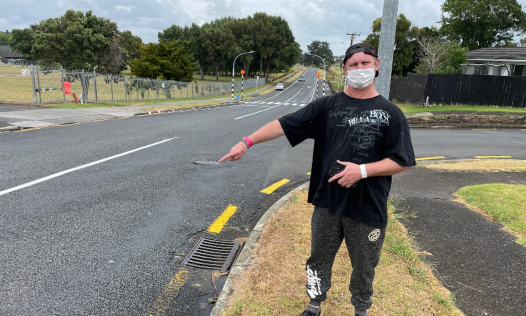 Jared Ifwersen points to where he was hit by a speeding car in 1985.