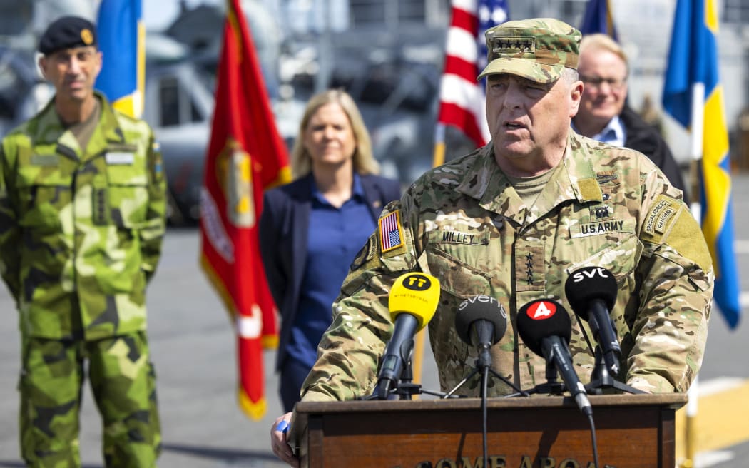 US Chairman of the Joint Chiefs of Staff, General Mark Milley speaks during a press conference, also attended by (L-R) Swedish Supreme Commander Micael Bydén, Swedish Prime Minister Magdalena Andersson and Swedish Defence Minister Peter Hultqvist, aboard the American amphibious warship USS Kearsarge in Stockholm, Sweden, on June 4, 2022, ahead of the Baltic Operations 'Baltops 22' exercise that will take place from June 5 to 17 in the Baltic Sea. (Photo by Fredrik PERSSON / TT NEWS AGENCY / AFP) / Sweden OUT