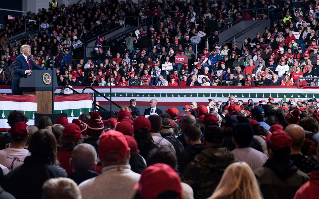 US President Donald Trump speaks during a Keep America Great Rally at Kellogg Arena December 18, 2019, in Battle Creek, Michigan. (Photo by Brendan Smialowski / AFP)